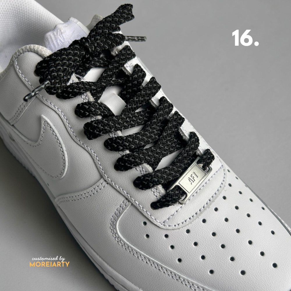 Reflective laces under flash showing silver glow effect on sneaker