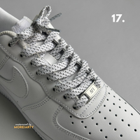 Multi-colour reflective laces showing light-up effect on sneaker