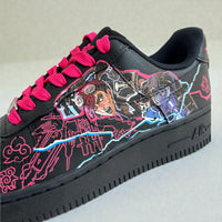 Close-up of custom Nike Air Force 1 sneaker inspired by Jinx from Arcane, featuring hand-painted character artwork, neon pink line art, electric blue detailing, and bright pink laces on a black leather base.