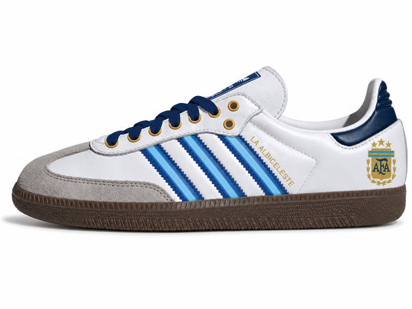 Moreiarty custom Adidas Samba — FIFA 2026 Argentina edition, white leather with sky blue and navy stripes, gold La Albiceleste lettering and AFA three-star crest