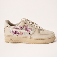 Coffee dyed sneakers with orchids painted onto the sides