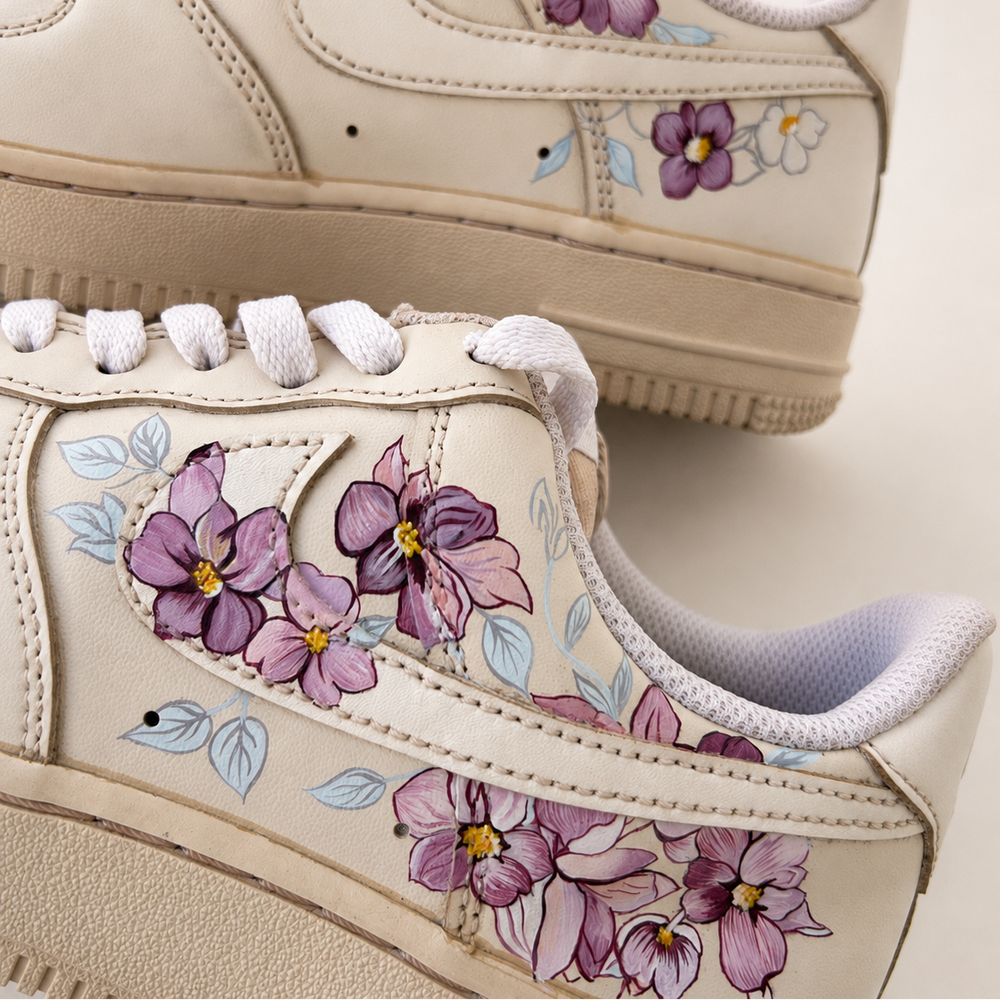 Coffee dyed sneakers with orchids painted onto the sides