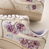 Coffee dyed sneakers with orchids painted onto the sides