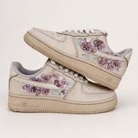 Coffee dyed sneakers with orchids painted onto the sides