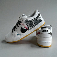 Custom Star Wars Nike Dunk Low sneakers with hand-painted Darth Vader reaching artwork, black swoosh, red lightsaber accents, and gum outsole.