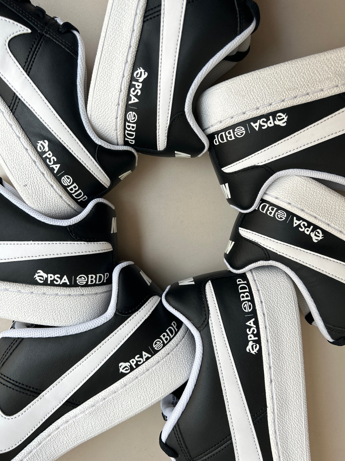 PSA BDP black sneakers with white logo