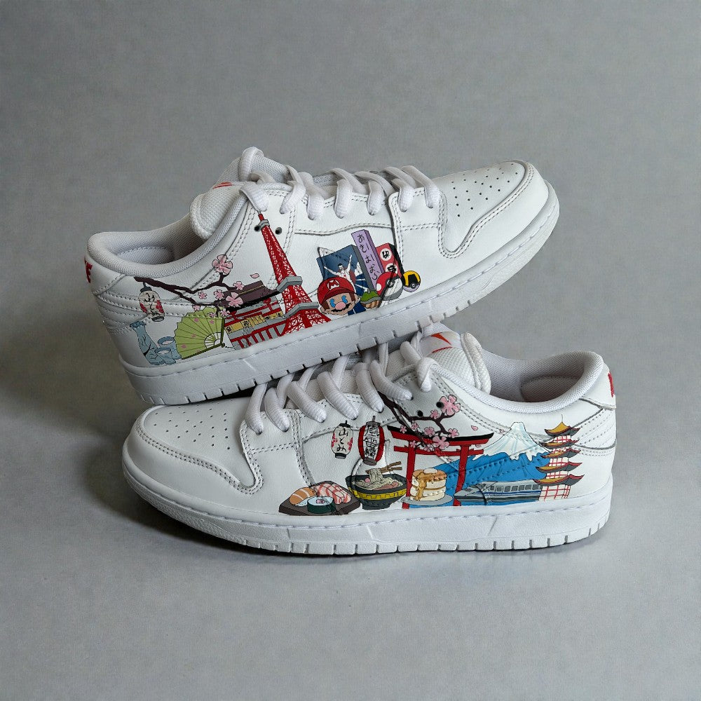 Custom hand-painted sneakers inspired by Japanese culture, travel, and cityscape illustrations on white leather.