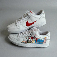 Custom hand-painted white Nike sneakers featuring Japanese cityscape illustrations with torii gate, cherry blossoms, food motifs, and travel-inspired artwork.