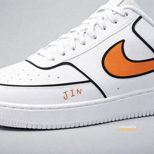 BT21 RJ Court Vision side panel with orange Nike logo and JIN lettering